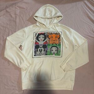 Disney Women's Cream Graphic Mickey, Tiana, Snow White, & Simba Hoodie
